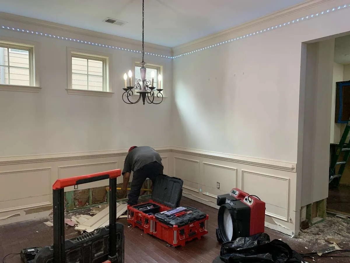 Restoration technician with professional equipment in Tysons